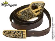Belt AD1080‑1179 A leather belt with a bone buckle and bone strap end with Romance style floral decoration.