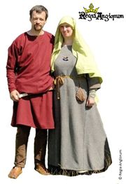 English Ceorl AD793‑899 The woman is wearing an open palla whilst the man wears a simple madder dyed tunic and carries a seax.
