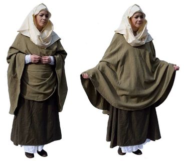English Thegnly Woman AD900‑1179 A wealthy woman wearing a veil over her woollen mantle. Under this she wears a woollen dress cut slightly short in the arm and skirt to expose a little of the linen undershift beneath.