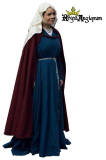 High Status Lady AD1180‑1215 Gown tight at the body with full skirt and Magyar sleeves and a tablet woven belt. Semi-circular cloak, tied open across the chest. Oval open faced wimple with barbette.